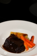 Sticky Beef Short Ribs with Potato Gratin, Honey Glazed Carrots and Braised Leeks